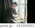 Dramatist writing dialogue surrounded by cues and sunlit ambiance Dramatist writing dialogue surrounded by cues and sunlit ambiance 143305691
