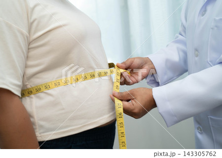 Asian woman with fat belly big size overweight and obesity with measure tape. Asian woman with fat belly big size overweight and obesity with measure tape. 143305762