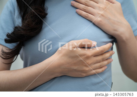 Asian woman self touching check lump or Breast cancer, Breast Self Exam. Asian woman self touching check lump or Breast cancer, Breast Self Exam. 143305763