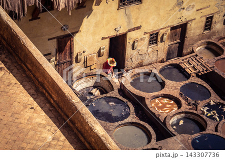Elevated view of dye vats at the historic Chouara Tannery in Fes 143307736