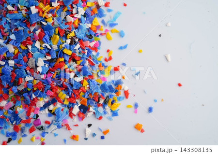 Plastic colorful pieces recycling shredded for industrial use. Plastic colorful pieces recycling shredded for industrial use. 143308135