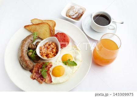 Full english breakfast with eggs, bacon, sausage, beans, toast Full english breakfast with eggs, bacon, sausage, beans, toast 143309975