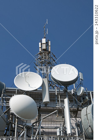 Telecommunications Antennas and Satellite Dishes on Rooftop Tower 143310622