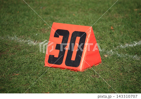 Football 30 Yard Marker on Grass Field Football 30 Yard Marker on Grass Field 143310707