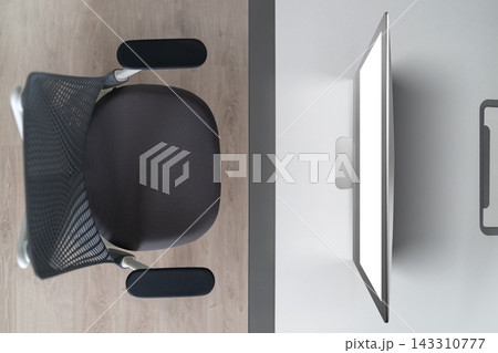 Modern Office Desk with Ergonomic Chair and Computer Monitor 143310777
