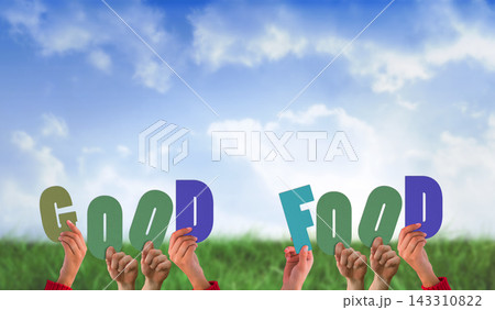 Good Food Sign Held by Hands in Green Field Under Blue Sky Good Food Sign Held by Hands in Green Field Under Blue Sky 143310822
