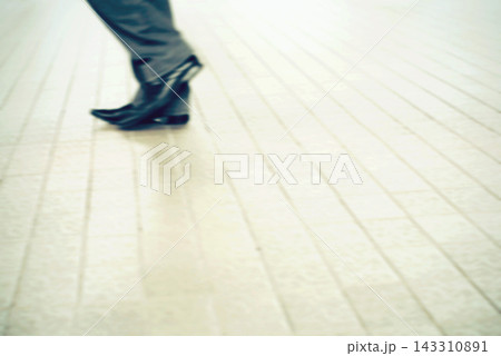 Business Shoes Walking on Bright Tiled Floor with Copy Space 143310891
