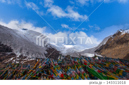 Tibetan Prayer Flags in Front of Snow Capped Mountains and Glaciers 143311018