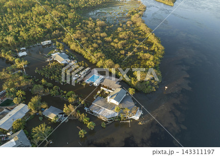 Aftermath of natural disaster. Flooded houses by hurricane Ian rainfall in Florida residential area 143311197