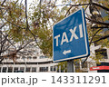 Taxi sign in city street 143311291