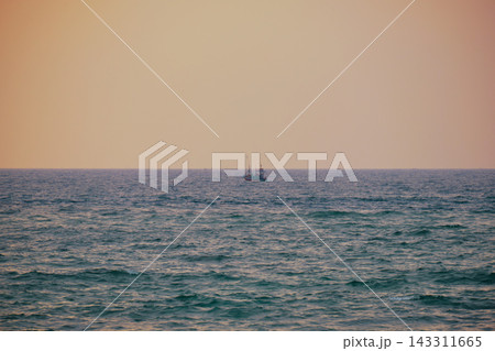 Stunning sunset over Indian Ocean on Hikkaduwa Beach Sri Lanka with calm waves Stunning sunset over Indian Ocean on Hikkaduwa Beach Sri Lanka with calm waves 143311665