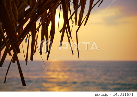 Stunning sunset over Indian Ocean on Hikkaduwa Beach Sri Lanka with calm waves Stunning sunset over Indian Ocean on Hikkaduwa Beach Sri Lanka with calm waves 143311671