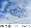 Blue sky with scattered white clouds. Natural weather background 143315294