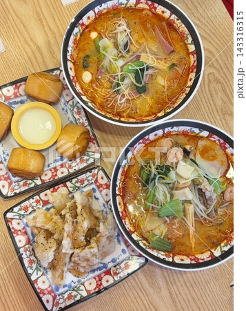 Spicy and numbing malatang with a mix of fresh ingredients in rich Sichuan broth, paired with crispy and tangy guobaorou. A perfect balance of bold heat and sweet-sour crunch for a Chinese feast. 143316315