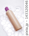 Beige Cosmetic Bottle on White Foamy Surface 143320046
