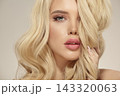 Attractive female beauty model with luxurious blonde hair, close up 143320063