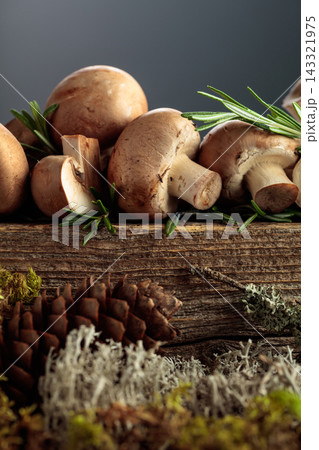 Mushrooms on a old wooden board. Mushrooms on a old wooden board. 143321975