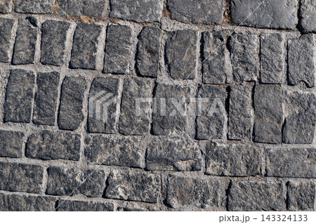 Cobblestone road texture background, dark gray granite 143324133