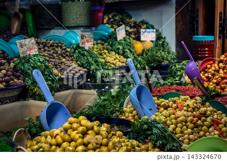 Assorted seasoned olives at a market stall in Fes souk 143324670