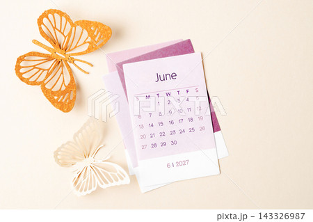 June 2027 calendar page with craft paper cutting butterfy shape. 143326987