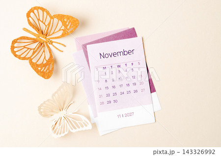 November 2027 calendar page with craft paper cutting butterfy shape. 143326992
