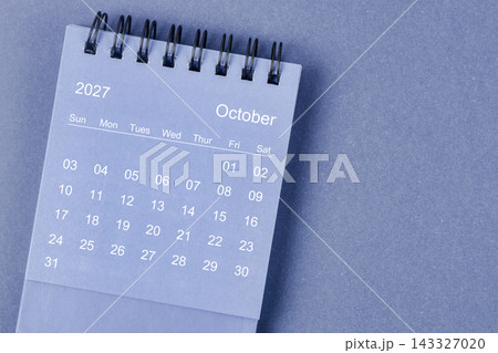 October 2027 Monthly desk calendar for 2026 year on blue background. October 2027 Monthly desk calendar for 2026 year on blue background. 143327020