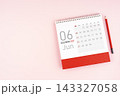 June 2027 desk calendar and red pencil, Position with copy space. 143327058