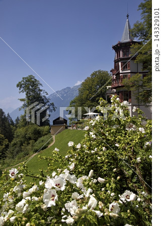 Giessbach grandhotel exterior with blooming white flowers in summer Giessbach grandhotel exterior with blooming white flowers in summer 143329101