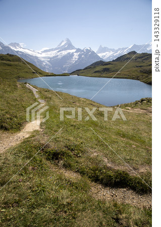 Bachalpsee lake reflecting bernese alps mountains in switzerland 143329118