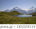 Lake bachalpsee reflecting wetterhorn and schreckhorn mountains 143329119