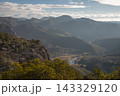 Mountain range, river winding through valley landscape 143329120