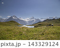People enjoying scenic view of bachalpsee lake and swiss alps 143329124