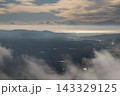 Mountain landscape overlooking sea through clouds at dawn 143329125