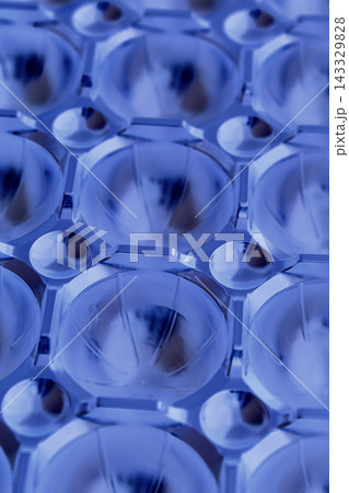 Futuristic background of spherical segments illuminated by diffused blue light Futuristic background of spherical segments illuminated by diffused blue light 143329828