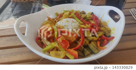 Colorful curry stir fry vegetables with rice bowl Colorful curry stir fry vegetables with rice bowl 143330829