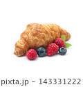 Croissant with raspberries and blueberries on white backgrounds 143331222