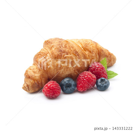 Croissant with raspberries and blueberries on white backgrounds 143331222