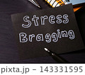 Stress bragging handwritten on paper highlighting unhealthy workplace competition. 143331595