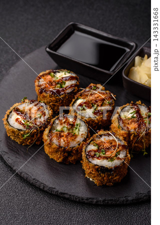 Hot tempura sushi rolls with tuna, rice, soy sauce, wasabi, and ginger. Hot tuna tempura roll Hot tempura sushi rolls with tuna, rice, soy sauce, wasabi, and ginger. Hot tuna tempura roll 143331668