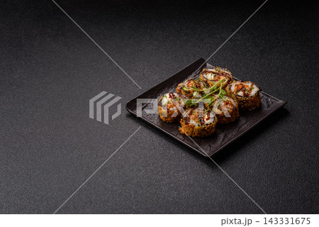 Hot tempura sushi rolls with tuna, rice, soy sauce, wasabi, and ginger. Hot tuna tempura roll 143331675