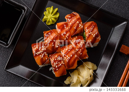 Philadelphia sushi roll with salmon, cream cheese, served with soy sauce. Philadelphia roll Philadelphia sushi roll with salmon, cream cheese, served with soy sauce. Philadelphia roll 143331688