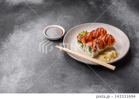 Philadelphia sushi roll with salmon, cream cheese, served with soy sauce. Philadelphia roll 143331694