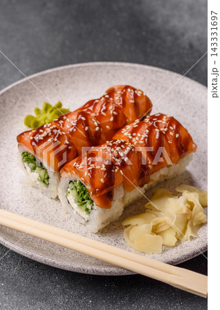 Philadelphia sushi roll with salmon, cream cheese, served with soy sauce. Philadelphia roll Philadelphia sushi roll with salmon, cream cheese, served with soy sauce. Philadelphia roll 143331697