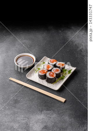 Sushi roll with tuna, rice, and cream cheese, served with soy sauce, wasabi, and ginger. Tuna roll Sushi roll with tuna, rice, and cream cheese, served with soy sauce, wasabi, and ginger. Tuna roll 143331747