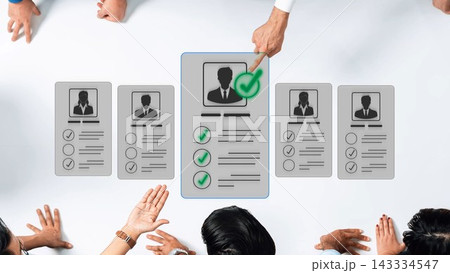 A diverse team evaluates job candidates by reviewing resumes and marks during a collaborative hiring meeting, highlighting teamwork and decision-making processes. Sigmoid A diverse team evaluates job candidates by reviewing resumes and marks during a collaborative hiring meeting, highlighting teamwork and decision-making processes. Sigmoid 143334547