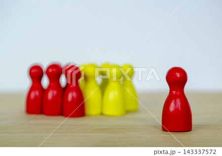 Red and Yellow figures positioned together and lead by the leader, representing diversity, equal opportunity, inclusion, and collaborative leadership Red and Yellow figures positioned together and lead by the leader, representing diversity, equal opportunity, inclusion, and collaborative leadership 143337572