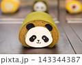 Cute Panda Roll Cake With Matcha Sponge and Cream Filling on Display 143344387