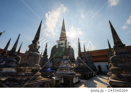 Wat Phra Mahathat Woramahawihan at sunset, historic Buddhist temple and iconic pagoda in Nakhon Si Thammarat, Thailand. Wat Phra Mahathat Woramahawihan at sunset, historic Buddhist temple and iconic pagoda in Nakhon Si Thammarat, Thailand. 143348164