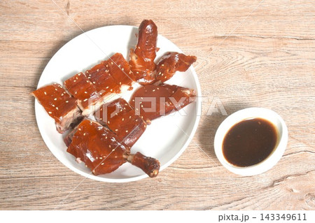 chop crispy skin fermenting with sesame roasted duck on plate dipping black sweet soy sauce chop crispy skin fermenting with sesame roasted duck on plate dipping black sweet soy sauce 143349611