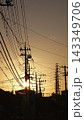 電柱と夕日のシルエット 143349706